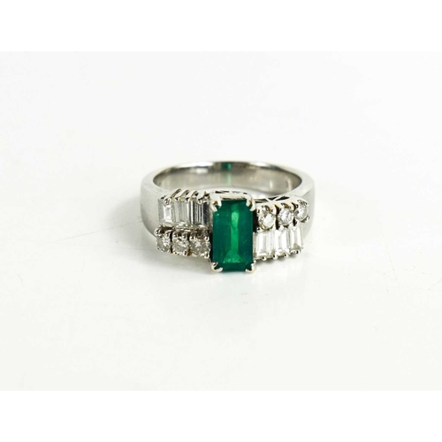 7 - A 14ct white gold, emerald and diamond Art Deco style dress ring, the central emerald of approximate... 