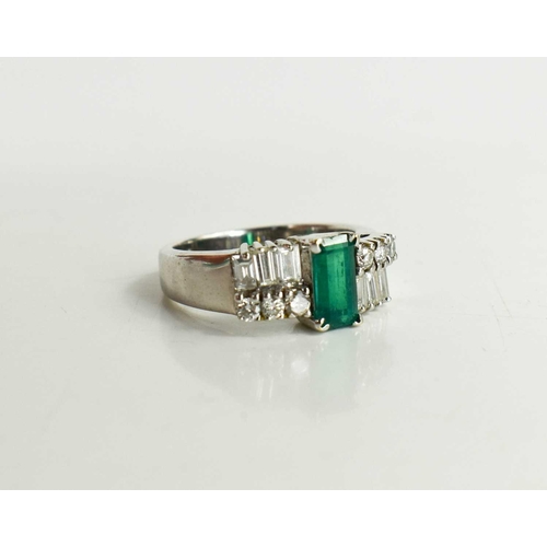 7 - A 14ct white gold, emerald and diamond Art Deco style dress ring, the central emerald of approximate... 