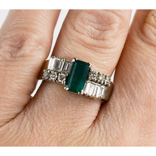 7 - A 14ct white gold, emerald and diamond Art Deco style dress ring, the central emerald of approximate... 