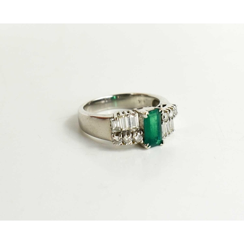 7 - A 14ct white gold, emerald and diamond Art Deco style dress ring, the central emerald of approximate... 