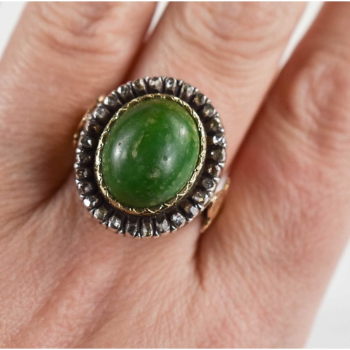 8 - A 19th century dress ring, set with oval green stone cabochon, 14.5 by 12mm, surrounded by twenty ei... 