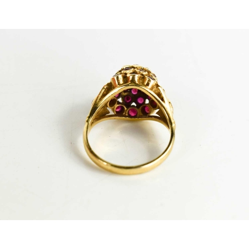 85 - A 14ct gold and pink sapphire cluster / flower head ring, of raised form with central brilliant cut ... 