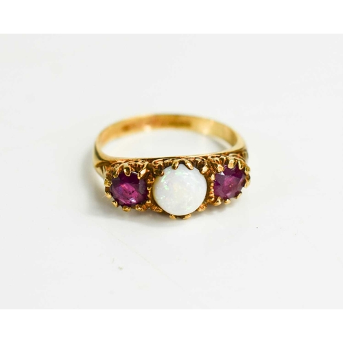 90 - A Victorian 9ct gold, pink sapphire and opal ring, the round opal cabochon flanked by brilliant cut ... 