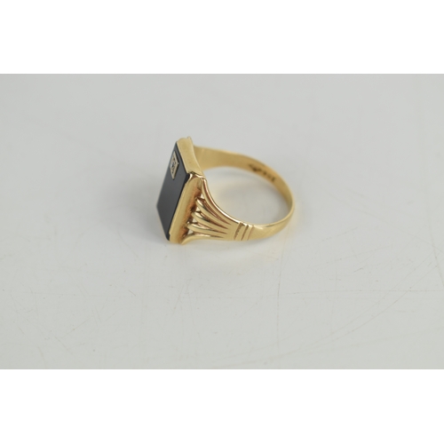 44a - A gentleman's 9ct gold, jet and diamond ring, the rectangular table of jet set with diamond to one c... 