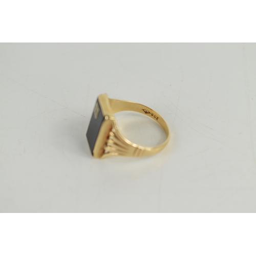 44a - A gentleman's 9ct gold, jet and diamond ring, the rectangular table of jet set with diamond to one c... 