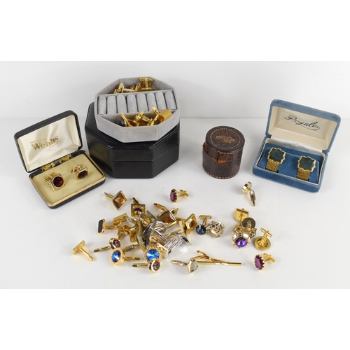 54a - A collection of twenty one pairs of gentleman's cufflinks, including a number of bright paste set ex... 