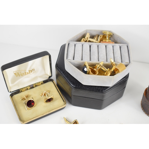 54a - A collection of twenty one pairs of gentleman's cufflinks, including a number of bright paste set ex... 