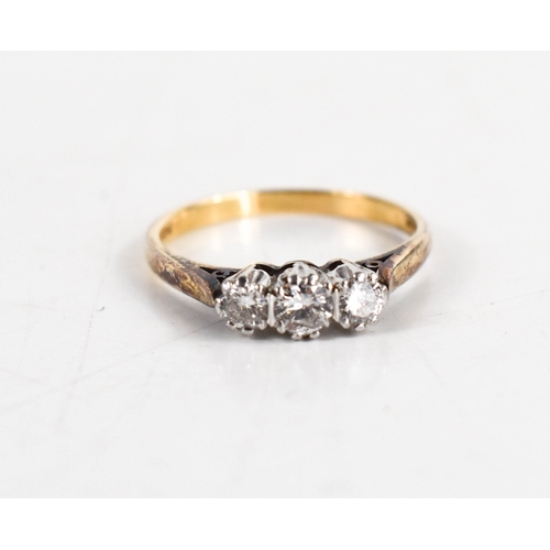 115 - A 9ct gold and diamond three stone ring, the largest central stone of approximately 3.7mm diameter, ... 