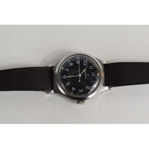 392A - A 1950s Omega Pilot's wristwatch, in, stainless steel case with black dial, Arabic numeral hours and... 