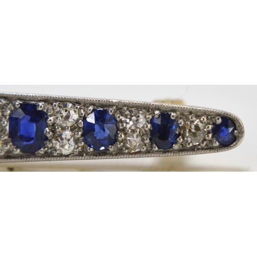 1 - An impressive diamond and cornflower blue sapphire brooch, of marquise form set with thirteen gradua... 