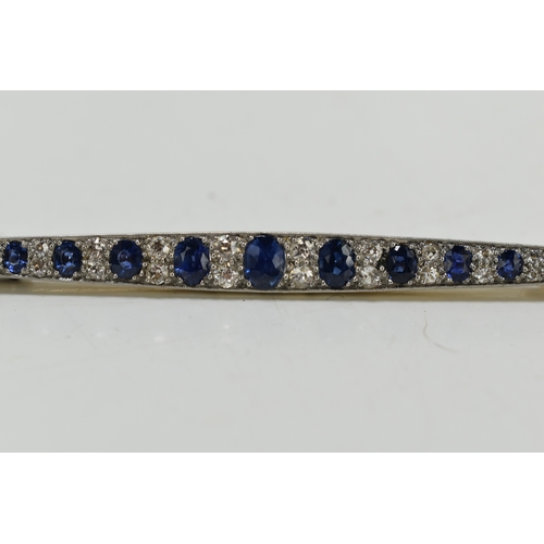 1 - An impressive diamond and cornflower blue sapphire brooch, of marquise form set with thirteen gradua... 