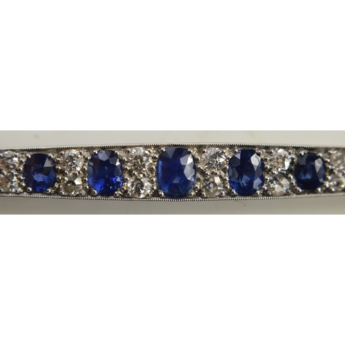 1 - An impressive diamond and cornflower blue sapphire brooch, of marquise form set with thirteen gradua... 