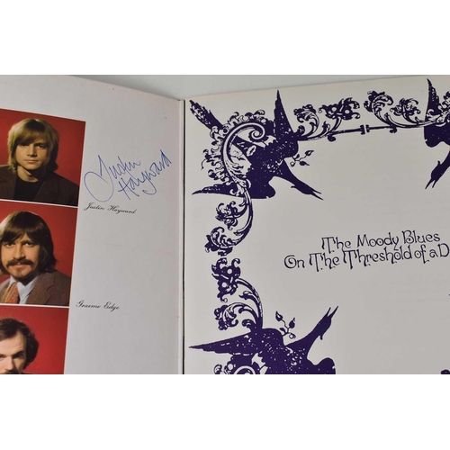 100 - Two autographed Moody Blues LP records, both signed by Justin Hayward.