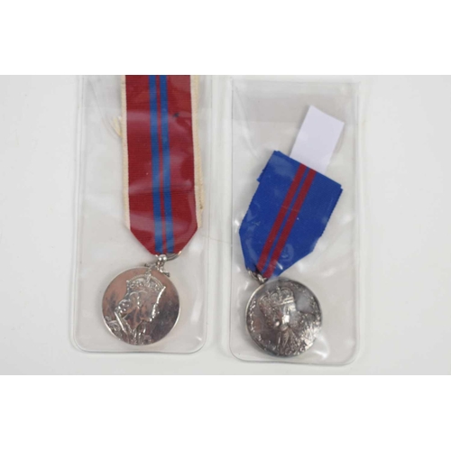 12 - A King George V Coronation medal 1911 together with an Elizabeth II coronation medal 1953.