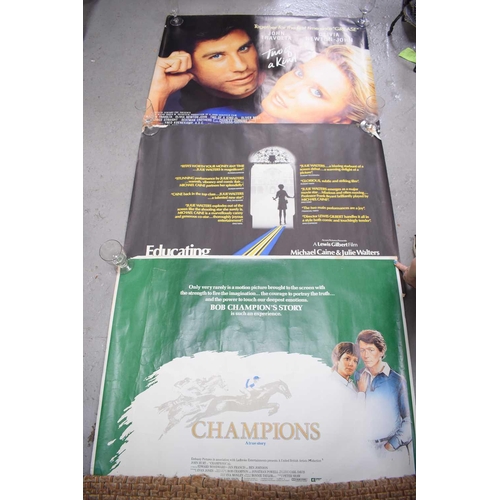 122 - Three original film posters, Champions, Educating Rita and Two of a Kind, quad size.