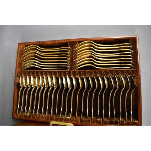 130a - A matched Continental and English silver gilt dessert service comprising nine dessert forks, nine de... 