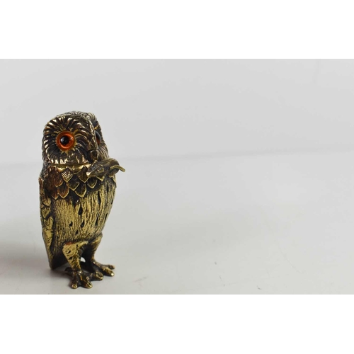 130 - A Tiffany & Co silver gilt novelty owl salt with amber glass eyes, and a hinged head, with the origi... 