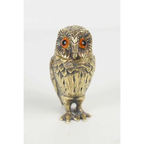 130 - A Tiffany & Co silver gilt novelty owl salt with amber glass eyes, and a hinged head, with the origi... 