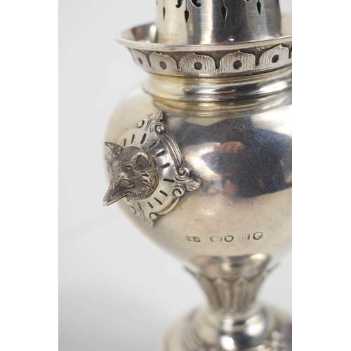 138 - A silver sugar castor, with silver gilt interior, pie crust detail to the top, decorative finial and... 