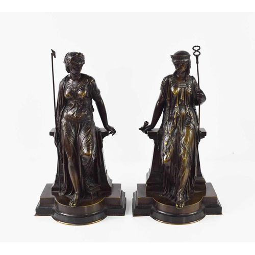 146 - Bouret (19th century): a pair of bronze figures; Egyptian and Greek female figures, holding staffs a... 