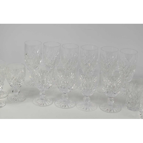 203 - A suite of Waterford Crystal comprising six champagne flutes, four red wine glasses, three white win... 