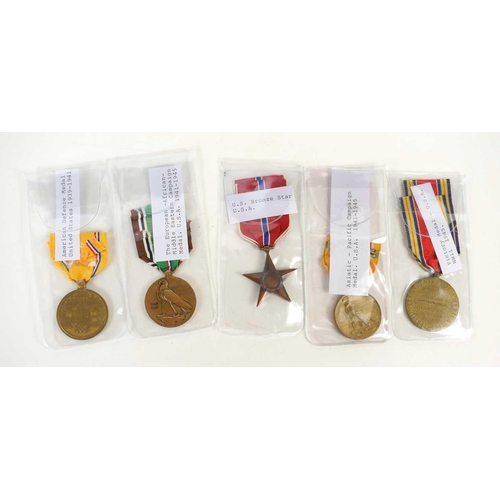 21 - A group of WWII USA medals comprising of the Pacific Campaign medal, Bronze Star, Victory medal, Def... 