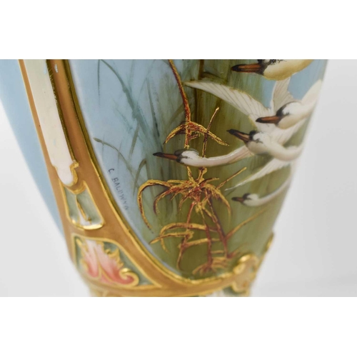 231 - A Royal Worcester vase by C Baldwyn, painted with six swans in flight, and six swallows to the rever... 