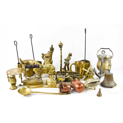 261 - A selection of brassware, to include measures, ornaments, pestle & mortar, bell, pan stand and other... 