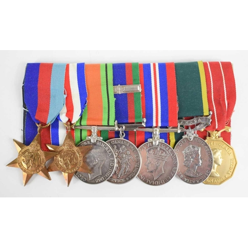 41 - A WWII and later medal group awarded to Sgt R.L. Belyea comprising of the 1939-1945 Star, France and... 