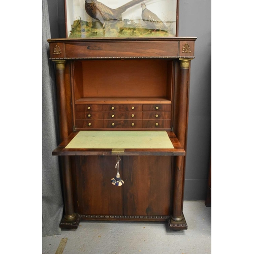 515 - A French Empire style secretaire with gilt metal mounts.