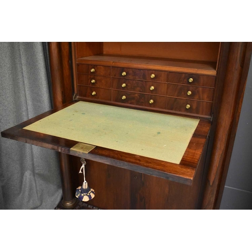 515 - A French Empire style secretaire with gilt metal mounts.