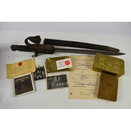 52 - A WWI bayonet, having belonged to Frederick William Ellis, his name inscribed to the leather scabbar... 