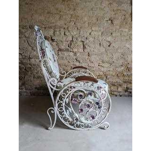 521 - A pair of fin-de-siecle cast iron garden chairs, with wrought iron roses, the frame painted cream wi... 