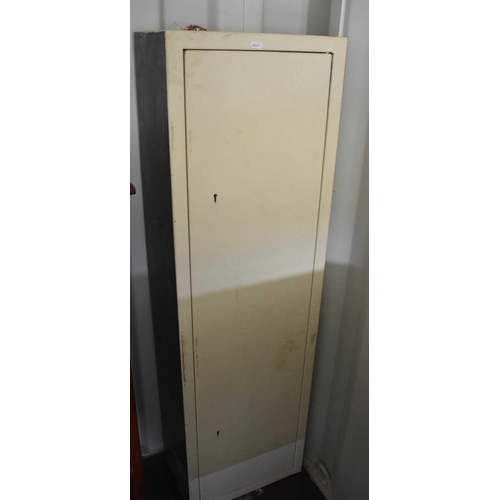 53 - A cream painted metal gun cabinet with keys, 39 by 25.5 by 130cm high.