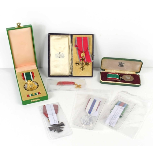 7 - A group of military medals to include a Liberation of Kuwait medal, Greek war cross, Operational Ser... 