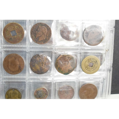 70 - Two albums of GB and worldwide coinage to include Chinese coins, silver coins, George III token, Que... 