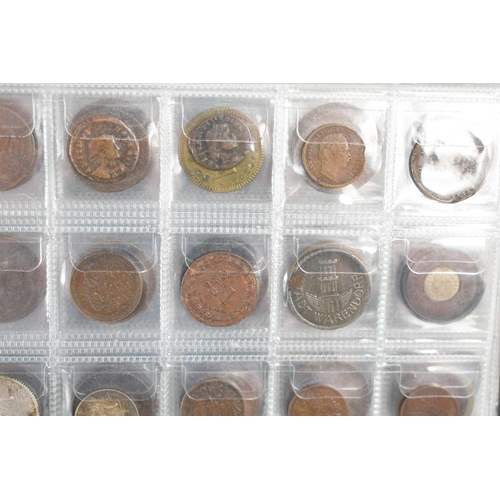 70 - Two albums of GB and worldwide coinage to include Chinese coins, silver coins, George III token, Que... 