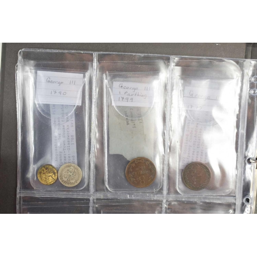 77 - An collection of GB and Worldwide coinage and tokens to include a silver US dollar, a George IV 1822... 