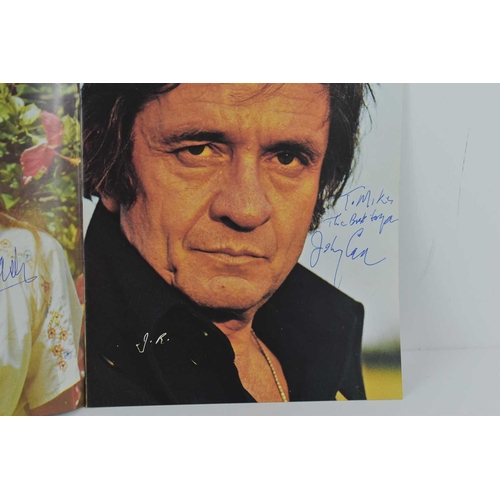 91 - An autographed Johnny Cash Silver Anniversary tour programme, signed by Johnny Cash and his wife Jun... 