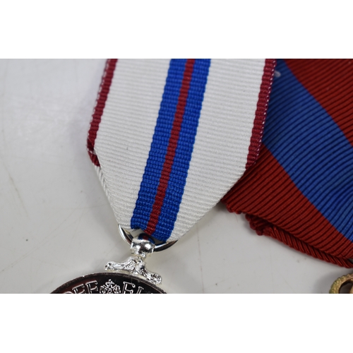 7 - A group of military medals to include a Liberation of Kuwait medal, Greek war cross, Operational Ser... 