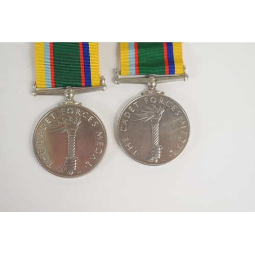 6 - Two Cadet Forces medals, one issued to Lt J.W McGuire, the other issued to Lieut F.Carson.