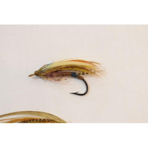 253 - Fishing Interest: two Edwardian salmon flies, together with a pair of similar vintage folding specta... 