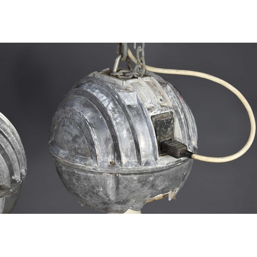 140 - A pair of vintage industrial cast aluminium ceiling lights of spherical globe form, 28cm diameter.