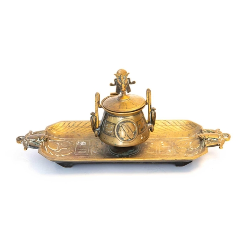 25 - An Egyptian Revival brass inkstand, the cover having a finial modelled as Baphomet / Mendes, above t... 