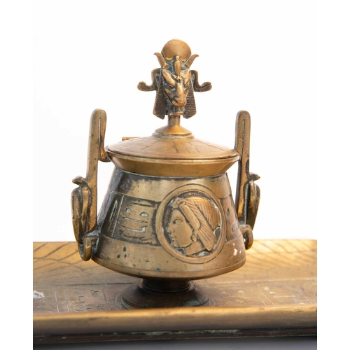 25 - An Egyptian Revival brass inkstand, the cover having a finial modelled as Baphomet / Mendes, above t... 