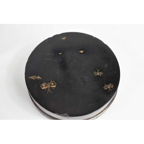 338 - Two 19th century, likely French, snuff or powder boxes, comprising an ebony box and cover, of circul... 