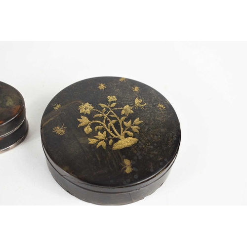 338 - Two 19th century, likely French, snuff or powder boxes, comprising an ebony box and cover, of circul... 