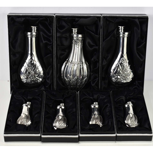 350 - A group of seven James Dixon & Sons large and small Cornish pewter flasks, in various styles to incl... 