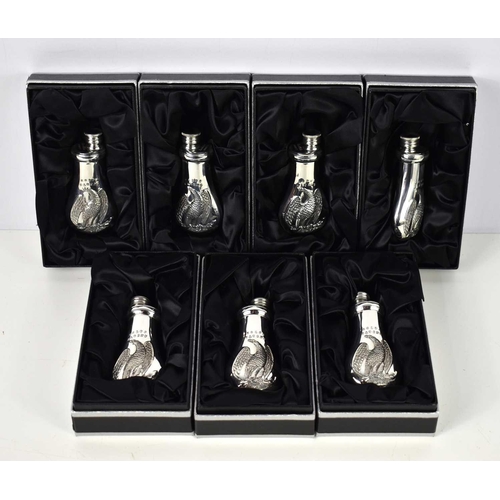 353 - A group of seven James Dixon & Sons small Cornish pewter flasks, decorated with the Colts Patent Bab... 