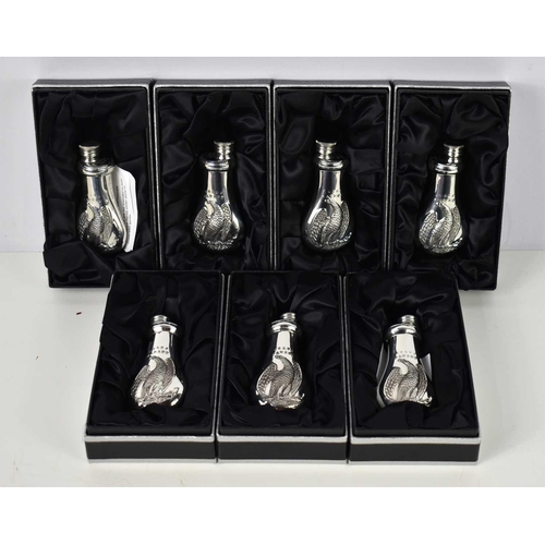 354 - A group of seven James Dixon & Sons small Cornish pewter flasks, decorated with the Colts Patent Bab... 